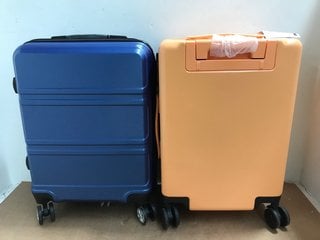 YKK CABIN SIZE HARD SHELL WHEELED SUITCASE IN NAVY TO ALSO INCLUDE PASTELS CABIN SIZE HARD SHELL WHEELED SUITCASE IN PEACH: LOCATION - I1