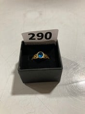 HALLMARKED GOLD COLOURED RING WITH BLUE STONE SET IN CELTIC DESIGN BASE