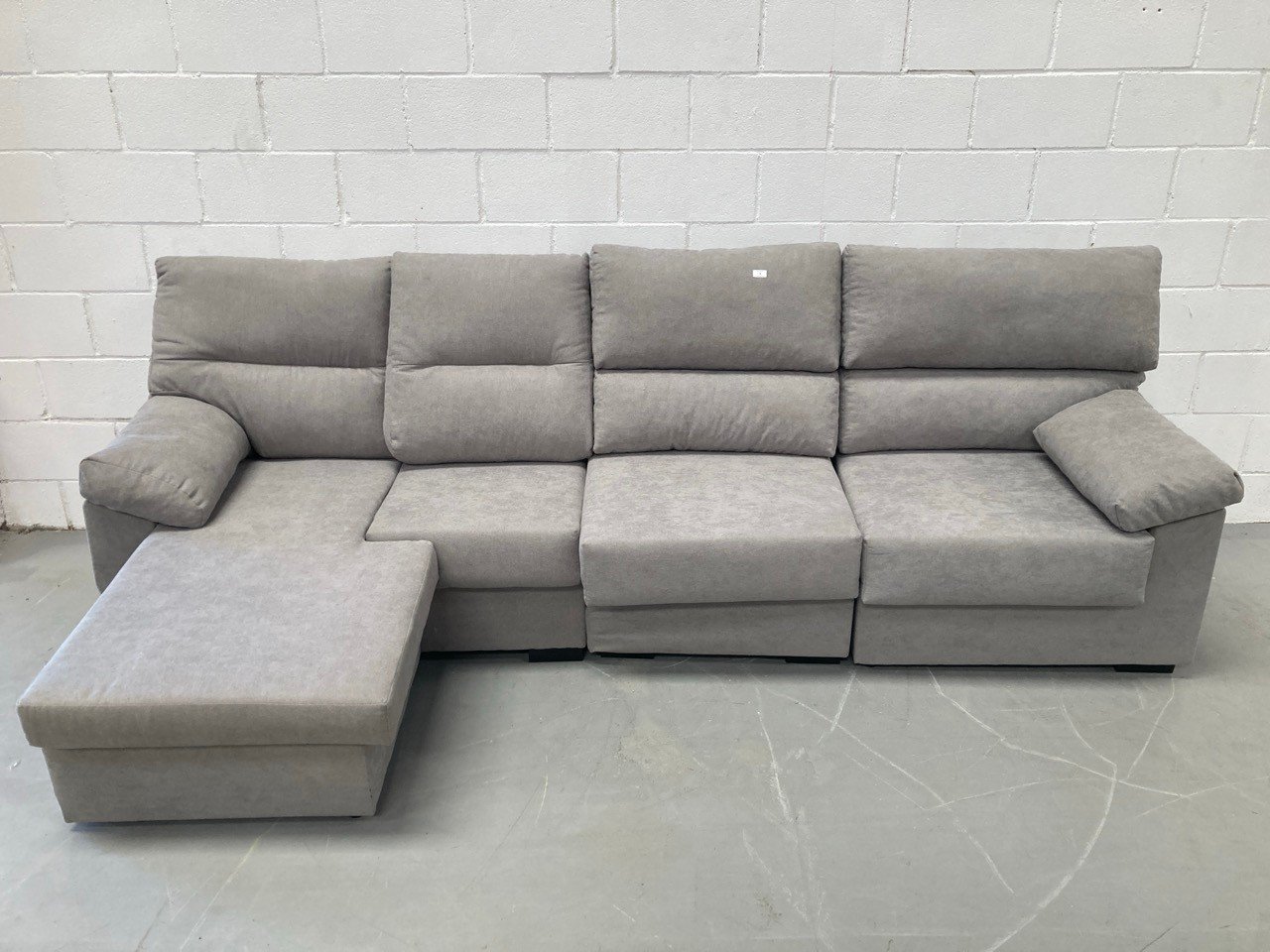 SOFA CHAISE LOUNGE GREY COLOUR 4 SEATER (NO BACK LEGS, DAMAGED MODULE IN THE MATERIAL).