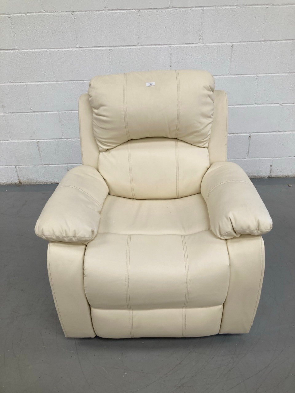 CREAM-COLOURED MASSAGE AND SELF-HELP CHAIR (BROKEN AND DIRTY).