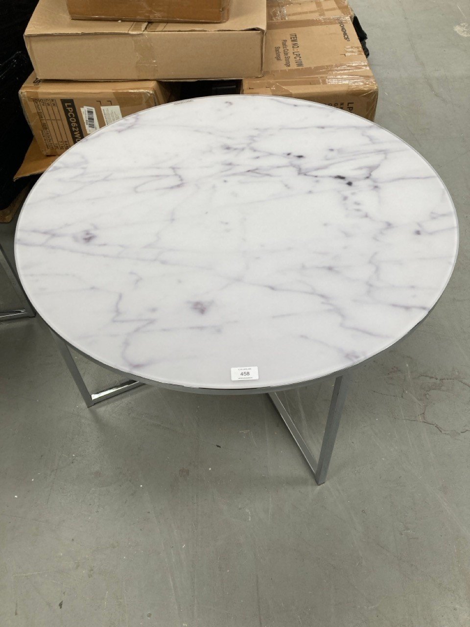 TEMPERED GLASS TABLE WITH MARBLE-COLOURED METAL LEGS.