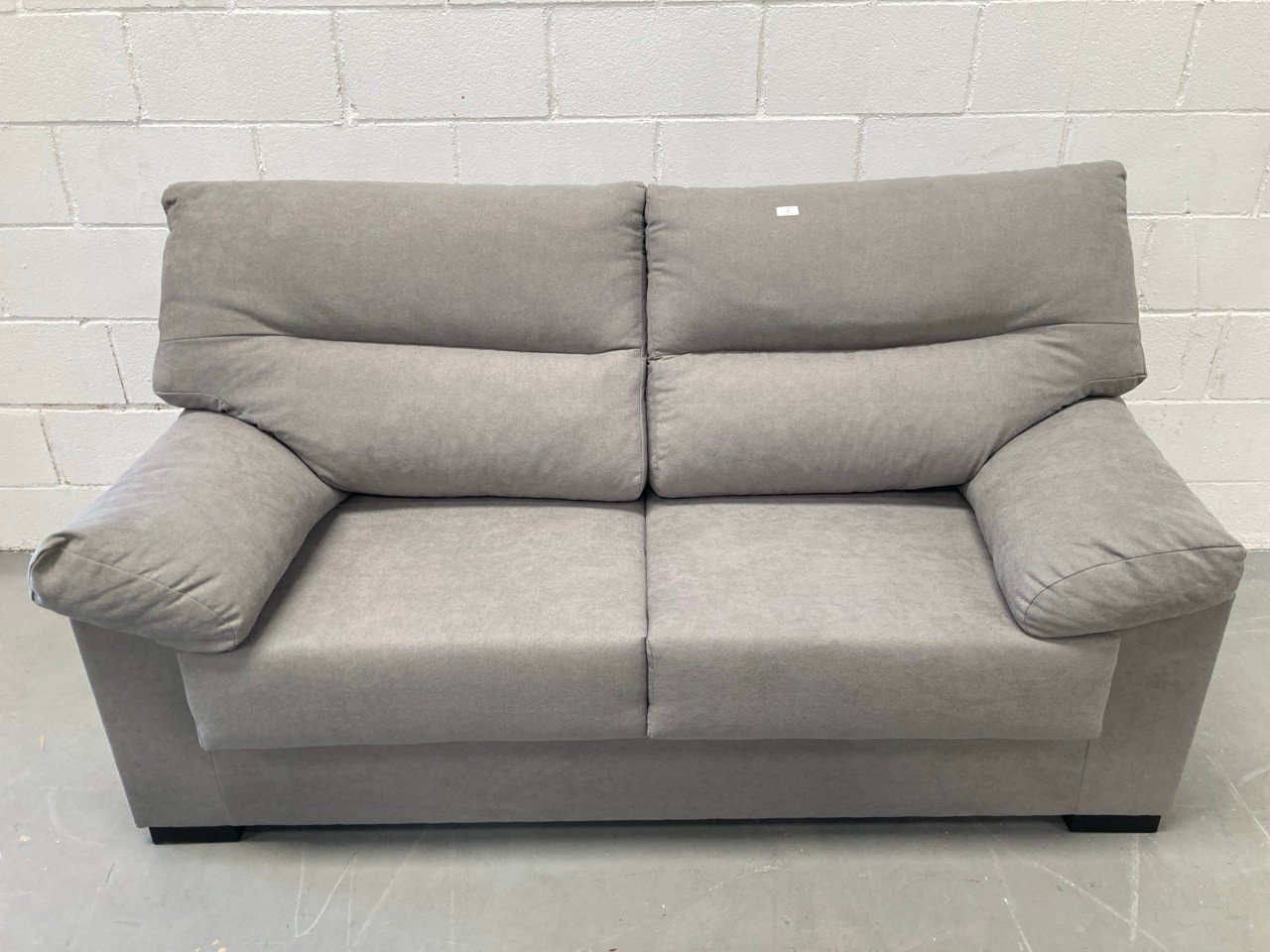 THREE SEATER SOFA GREY COLOUR .