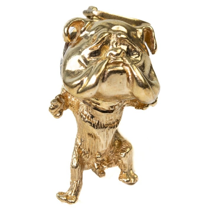 9ct Yellow Gold Clear Stone Bulldog Pendant, 4x1.5cm, 15.7g.  Auction Guide: £300-£400 (VAT Only Payable on Buyers Premium)