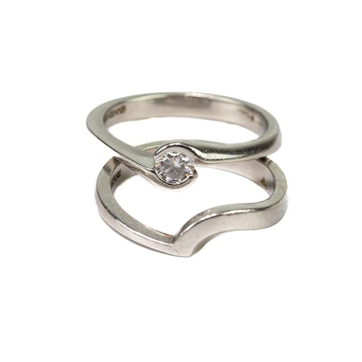 Platinum 950 0.10ct Diamond Twist Double Ring Set, Size M, 5.8g.  Auction Guide: £150-£200 (VAT Only Payable on Buyers Premium)