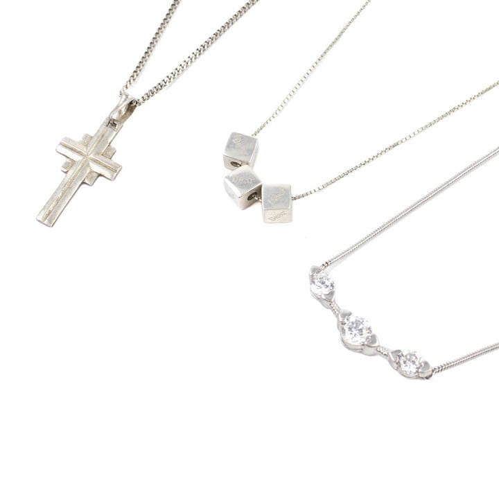 Silver Cross Pendant and Chain, 50cm. Silver Clear Three Stone Necklace, 43cm. Silver Three Cube Dear, Dear, Dear Adjustable Necklace, 42cm, total weight 18g (VAT Only Payable on Buyers Premium)