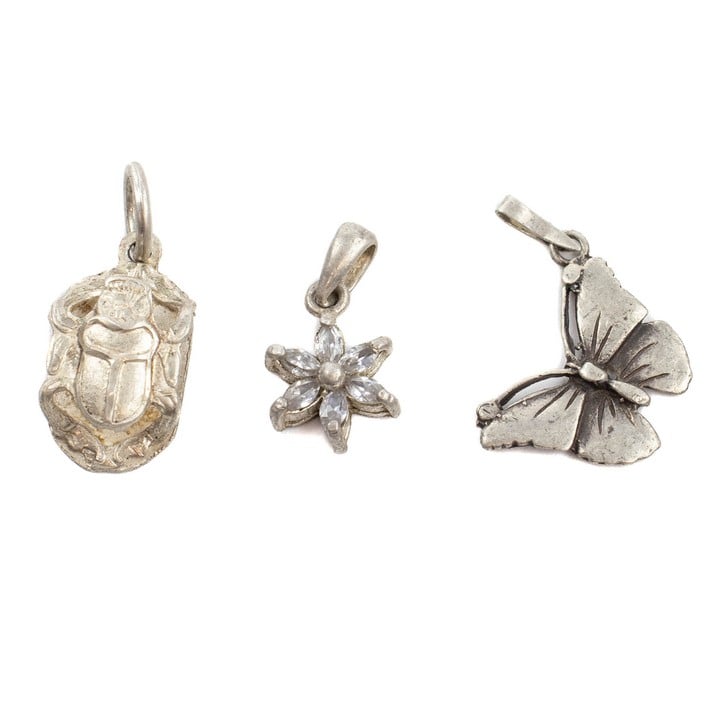 Silver Beetle Pendant, 2.4x1cm. Silver Butterfly Pendant, 2.5x1.8cm. Silver Purple Stone Flower Pendant, 2x1cm, total weight 4.4g (VAT Only Payable on Buyers Premium)