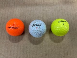 BOX OF TITLEIST TAYLORMADE MADE GOLF BALLS IN VARIOUS COLOURS: LOCATION - F15