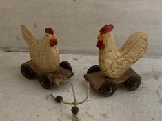 72 X STONE THE CROWS SM.PAIR OF COCK & HEN ON WHEELS - LENGTH 12 CM - TOTAL RRP £1080