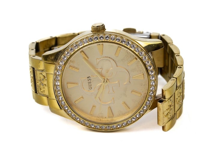 Guess Quartz Watch, Model: W1280L2 Champagne Dial with Clear Stone Bezel Gold Plated Stainless Steel Bracelet. Brief Condition Report: Signs of Wear, Missing Lug (Not Currently Running) (VAT Only Pay