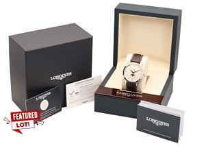 LONGINES FLAGSHIP ELEGANT GENTS AUTOMATIC WATCH: MODEL 1832. FEATURING A CREAM DIAL, SILVER COLOURED HANDS, MARKERS, BEZEL & CASE, SUNRAY DIAL, W/R 3ATM, STAINLESS STEEL CASE, BROWN LEATHER STRAP. CO