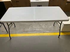 PLASTIC FOLDING TABLE FOR OUTDOOR USE IN WHITE COLOUR.