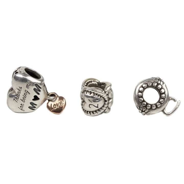 Pandora Silver Three Charms including Heart 21, Mum with Rose Gold Plated Love You Heart Drop, Spacer (faulty), total weight 5.9g (VAT Only Payable on Buyers Premium)