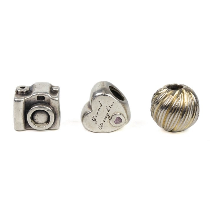 Pandora Silver Three Charms including Gold Plated Textured Clip Ball, Camera, Pink Stone Grand Daughter Heart, total weight 11.4g (VAT Only Payable on Buyers Premium)