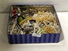 A TIN OF VINTAGE AND COSTUME JEWELLERY