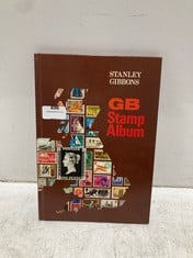 A VINTAGE STAMP ALBUM AND CONTENTS