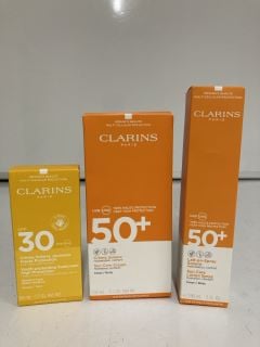 A COLLECTION OF CLARINS ITEMS TO INCLUDE YOUTH PROTECTING SUNSCREEN SPF 30 (3666057217333) SUN CARE LOTION SPRAY SPF 50+ (3380810305050) TOTAL RRP £64