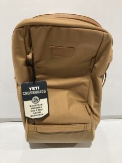 A BOX TO INCLUDE YETI CROSSROADS 35 TAN BACKPACK