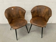 SET OF 2 RETRO VINTAGE STYLE DINING CHAIRS UPHOLSTERED IN SUEDE WITH ARMRESTS AND BLACK METAL LEGS.