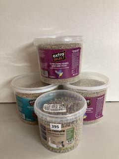 FOUR TUBS OF VARIOUS BIRD FEED