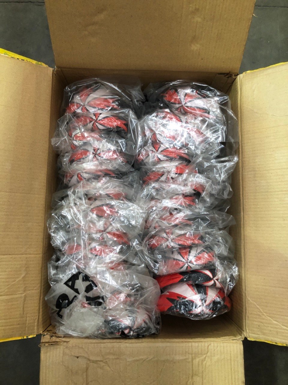 25 X ARAMIS RUGBY BALLS RED/WHITE: LOCATION - B