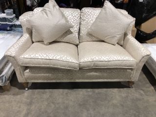 CREAM TWO SEATER SOFA EMBROIDERED PATTERNING