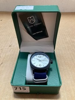 MEN'S FRANK SCHMIDT WATCH. FEATURING A WHITE PILOT DIAL, BLACK BEZEL AND CASE, W/R 3ATM. BLUE FABRIC STRAP. COMES WITH A PRESENTATION CASE: LOCATION - A13