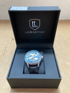 MEN'S LOUIS LACOMBE AUTOMATIC WATCH. FEATURING A BLUE SKELETON DIAL, SILVER COLOURED BEZEL, GLASS EXHIBITION BACK CASE, W/R 3ATM. BLACK LEATHER STRAP. COMES WITH A GIFT BOX: LOCATION - A13