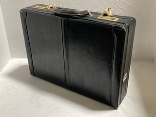 A LEATHER COMBINATION LOCK BRIEFCASE: LOCATION - BR9