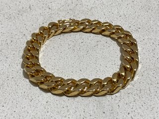 A GOLD COLOURED HEAVY BRACELET: LOCATION - BR9