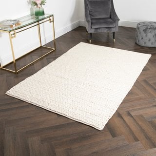 CREAM KNITTED LARGE WOOL RUG : SIZE 160 X 230CM: LOCATION - C9