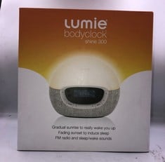 LUMIE BODYCLOCK SHINE 300 - WAKE-UP LIGHT ALARM CLOCK WITH RADIO, 15 SOUNDS AND SLEEP SUNSET, WHITE.: LOCATION - A RACK